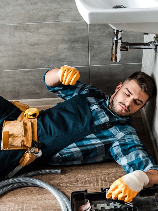 bearded-handyman-lying-on-floor-near-toolbox-in-ba-resize